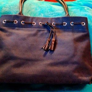 Dooney and Bourke bag with leather trim and handles.
